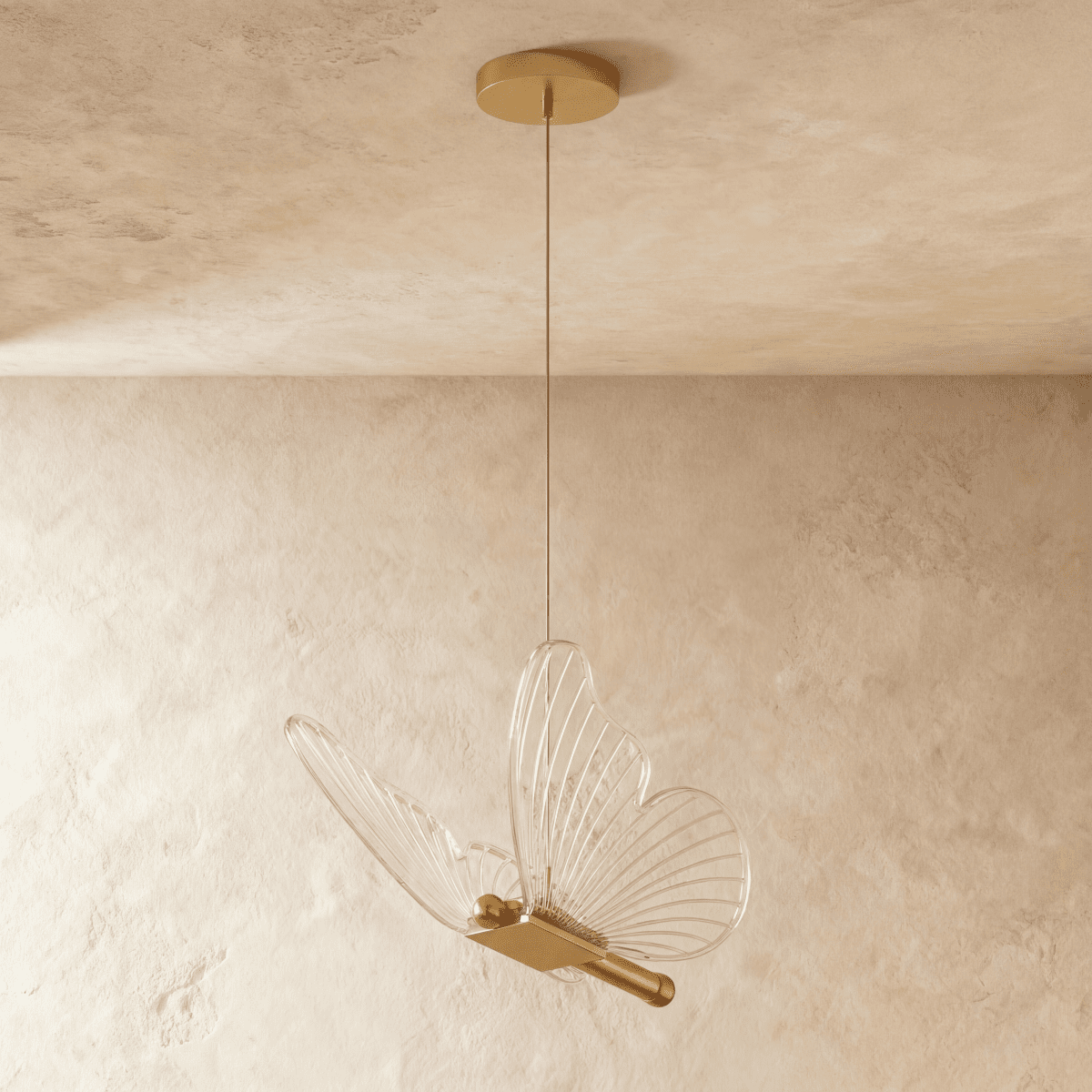 Clérachic brass butterfly pendant light with translucent ribbed wings, suspended from a round brass ceiling canopy.