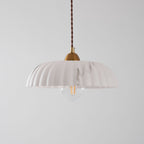 A paler white version of this Clérachic pendant, unlit, with a ribbed shade, grey veining and a clear filament bulb.