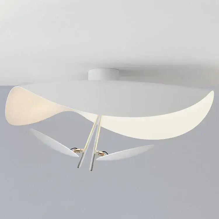 Studio view of the white Clérachic pendant light from below, showing the smooth curve of its saucer shade and two accent discs.
