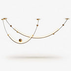 Two curved light strips on thin gold-toned wires with small brass balls, this Clérachic pendant on a plain white backdrop.