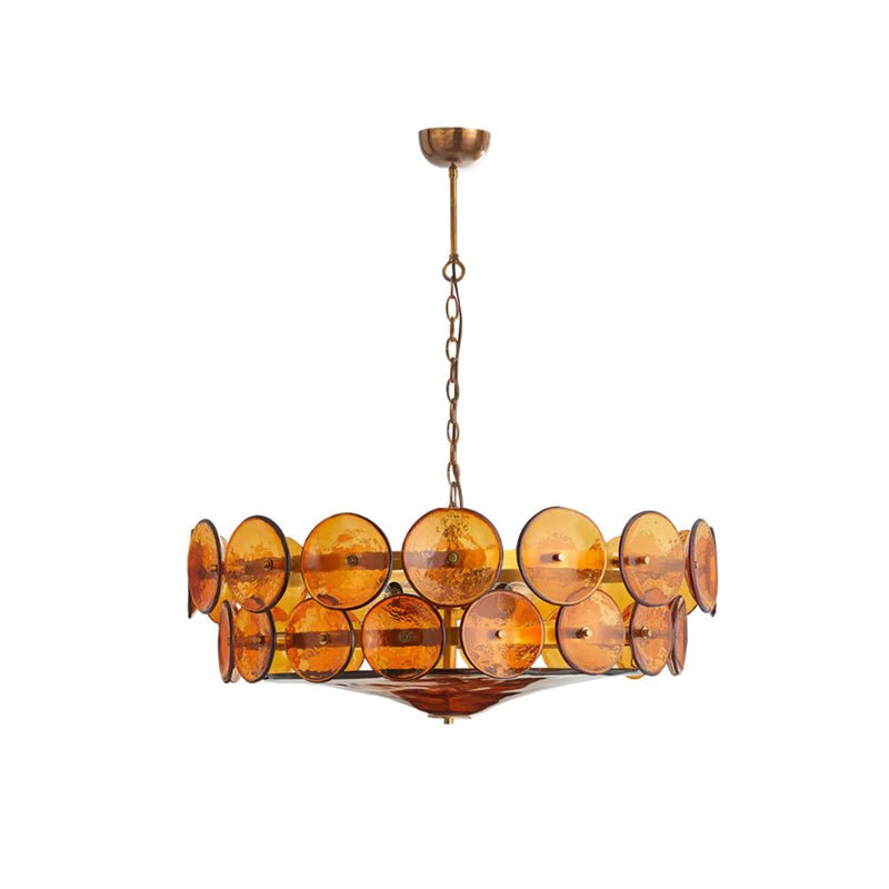 Amber and gold Clérachic chandelier hanging from a brass canopy and chain on a plain white background, unlit.