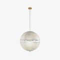 A pale sphere with a narrow ragged band across its middle on a slim cord with a brass-toned canopy, this Clérachic pendant on white.