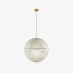 A pale sphere with a narrow ragged band across its middle on a slim cord with a brass-toned canopy, this Clérachic pendant on white.