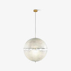 A pale sphere with a narrow ragged band hangs from a gold-toned stem and thin cord, this Clérachic pendant on white.
