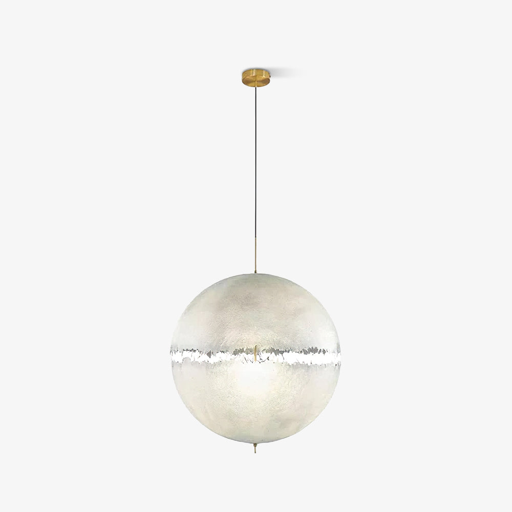 A pale sphere with a narrow ragged band hangs from a gold-toned stem and thin cord, this Clérachic pendant on white.