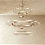 Clérachic gold chandelier of three stacked LED rings with fine mesh acrylic panels and small connecting rings, front view.