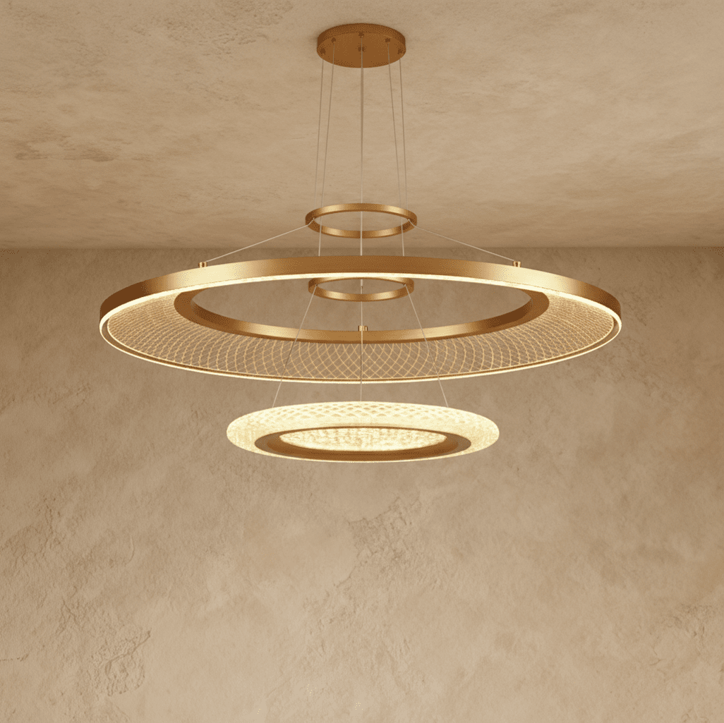 Clérachic two-ring brushed gold LED chandelier with a large mesh-filled ring above a smaller glowing disc, on a ceiling canopy.