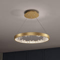 Gold Clérachic ring pendant light with clear glass pieces inside the band, seen from slightly below against a grey ceiling.