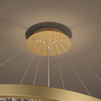 Close view of the gold ceiling plate and the cables running down to the ring on this Clérachic pendant light.