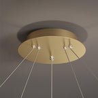 Close view of the round gold ceiling plate with small crystal-look fixings and cables on this Clérachic pendant light.