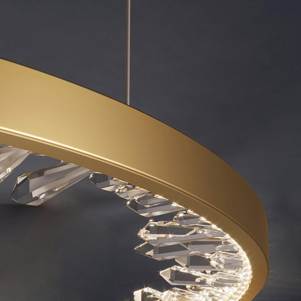 Close view of the gold band and the faceted clear glass pieces inside it on this Clérachic ring pendant light.