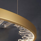 Close view of the gold band and the faceted clear glass pieces inside it on this Clérachic ring pendant light.