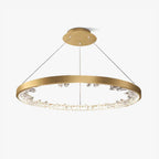 Single gold Clérachic ring pendant light on a white background, hung from a gold ceiling plate by thin cables.