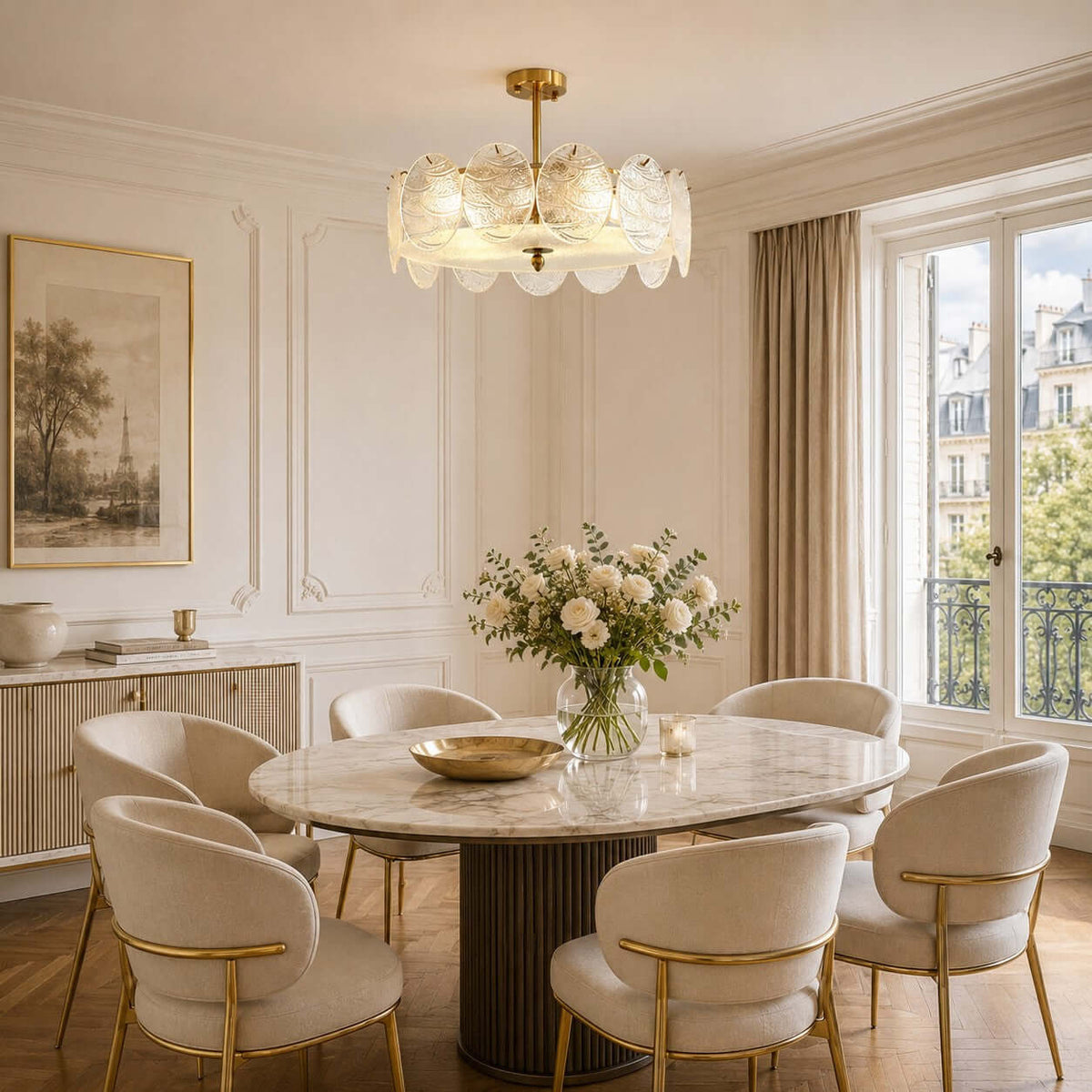 This Clérachic ceiling light glows above a round dining table with a bowl and white roses, beside tall windows with a city view.