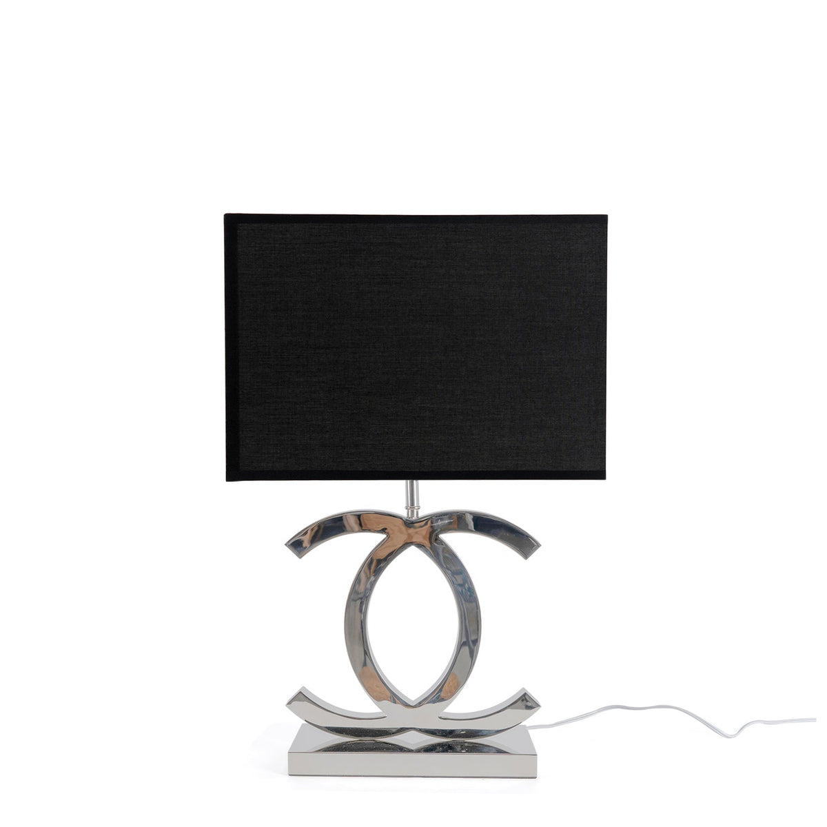 A Clérachic chrome table lamp with a black shade and a mirror-polished base, on white, with a white cord trailing to the right.
