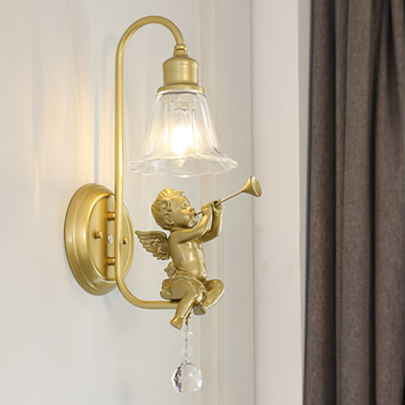 Close view of a gold cherub with a trumpet, a curved arm and a crystal drop on this Clérachic wall light.