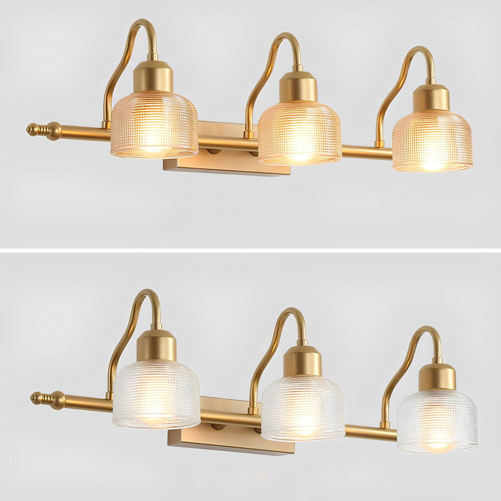 Three-light Clérachic wall lamp pictured twice on pale grey, with amber ribbed shades above and clearer, lighter glass below.