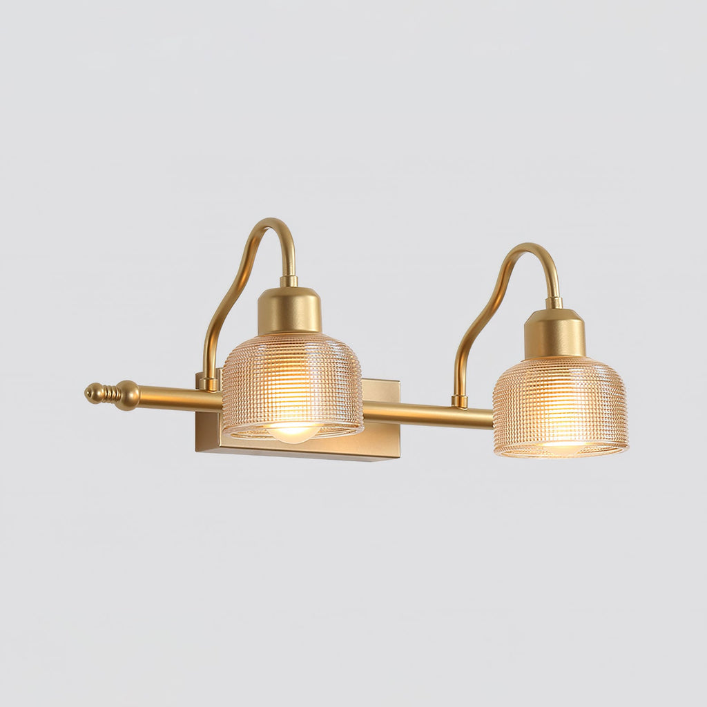 Two-light Clérachic wall lamp with amber ribbed glass shades, one larger than the other, on curved gold arms against pale grey.