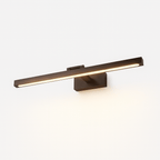 Clérachic wall lamp in bronze-brown, its LED strip glowing warmly along the horizontal bar.
