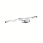 Clérachic wall lamp in brushed silver, its LED strip glowing along the horizontal bar in a studio shot on white.