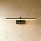 Clérachic black linear wall light with a slim horizontal bar and rectangular wall plate, glowing warm against plaster.
