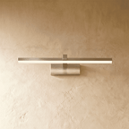 Clérachic silver linear wall light with a slender glowing bar mounted on a small rectangular wall plate.