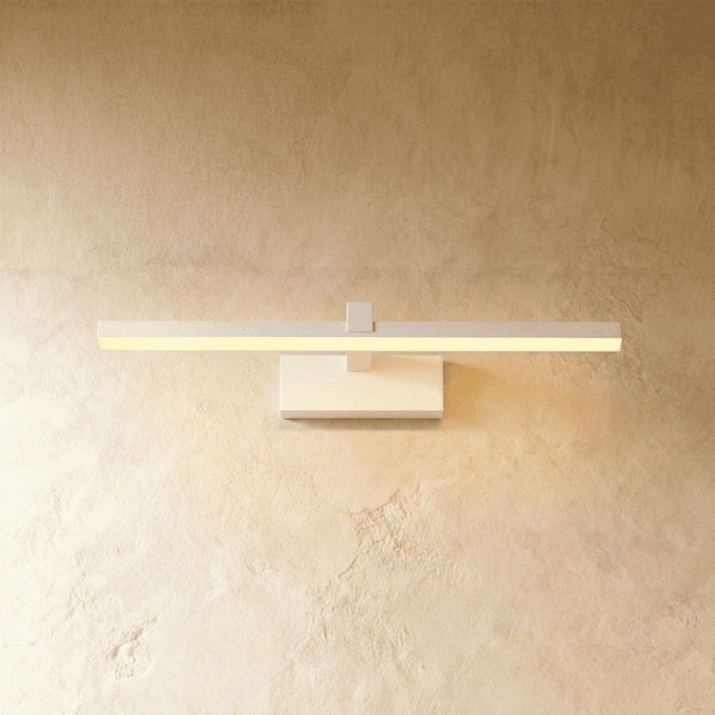 Clérachic white linear wall light with a slim horizontal bar and rectangular wall plate glowing on plaster.
