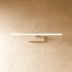 Clérachic white linear wall light with a slender glowing bar mounted flush on a plaster wall via a small plate.