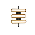 Three stacked frosted capsules in gold rims on a black backplate and rod, shown on a white backdrop, from Clérachic.