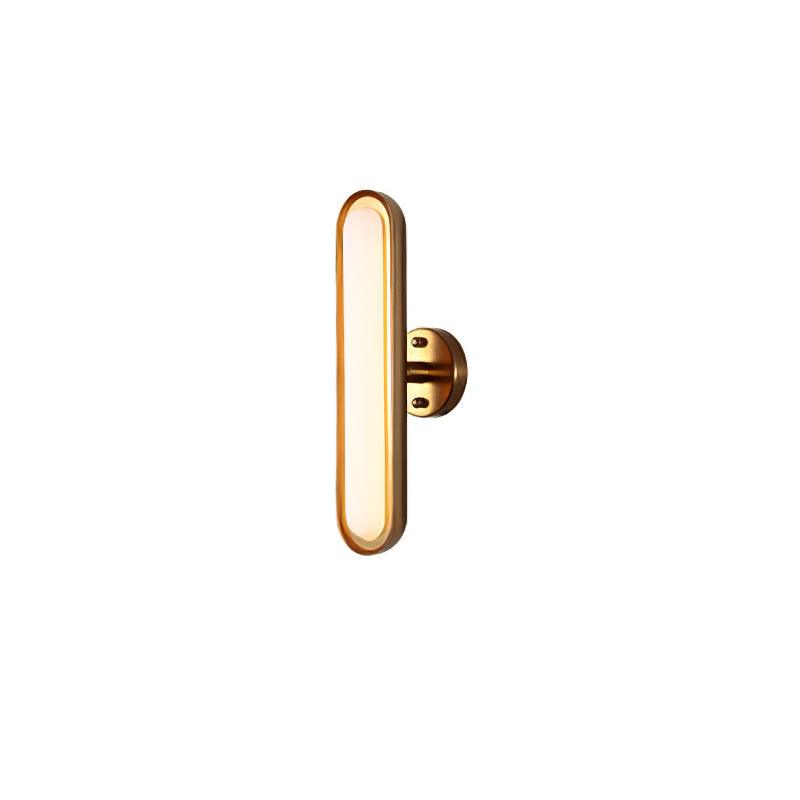 Side view of a single capsule wall light from Clérachic, with a gold rim, a frosted lens and a small gold round plate behind it.