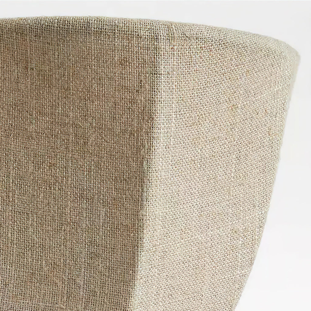 Close view of the woven linen on the rim and seam of this Clérachic wall sconce.