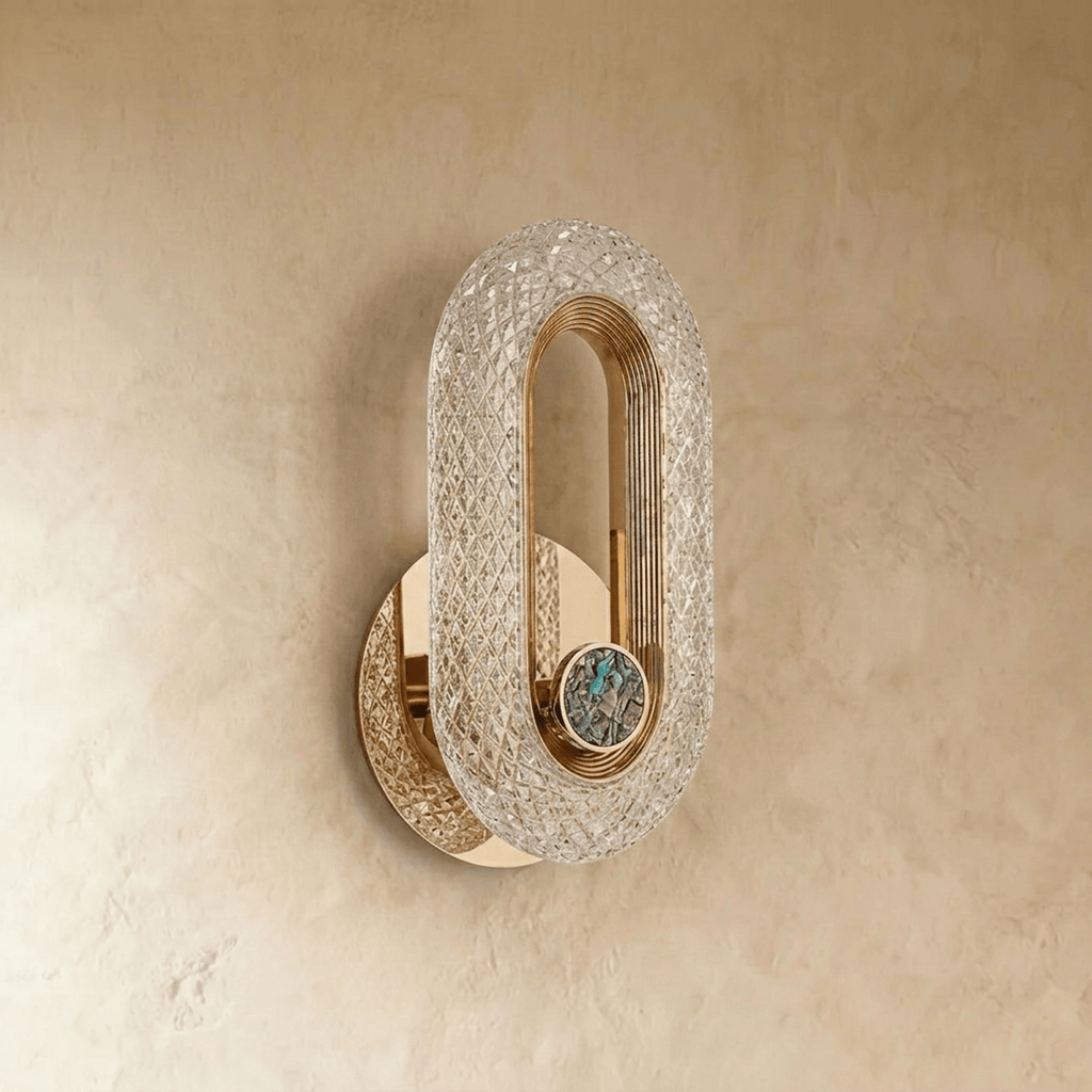 Clérachic unlit gold oval wall lamp with a faceted crystal-effect acrylic band and a small stone inlay on plaster.