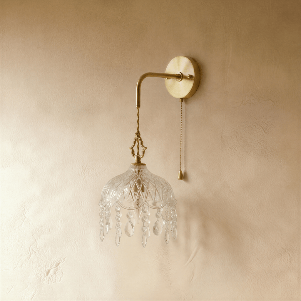 Clérachic unlit wall lamp: gold arm, twisted cord and cut-glass dome fringed with crystal drops, pull chain beside.