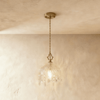 Clérachic pendant lamp unlit: gold canopy, twisted cord, cut-glass dome shade with a fringe of crystal drops.