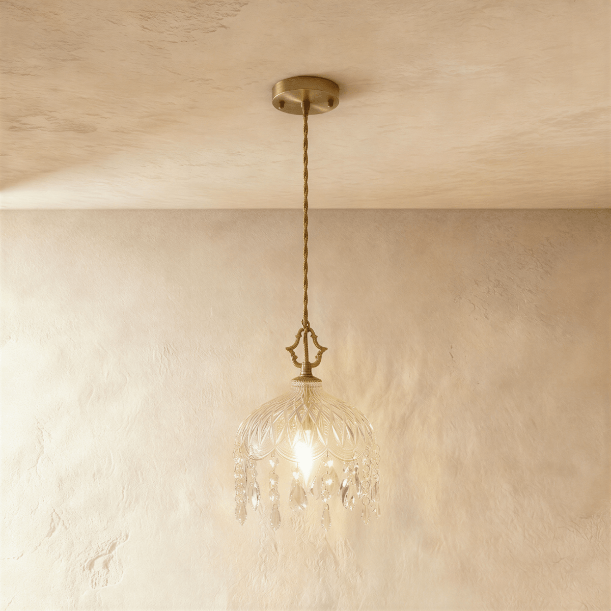 Clérachic pendant lamp unlit: gold canopy, twisted cord, cut-glass dome shade with a fringe of crystal drops.