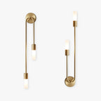 The Clérachic gold stick sconce shown in single- and double-shade versions, lit against white.