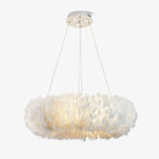 A Clérachic pendant with a flat ring of white goose feathers, hung on three fine cables from a round white canopy, on white.
