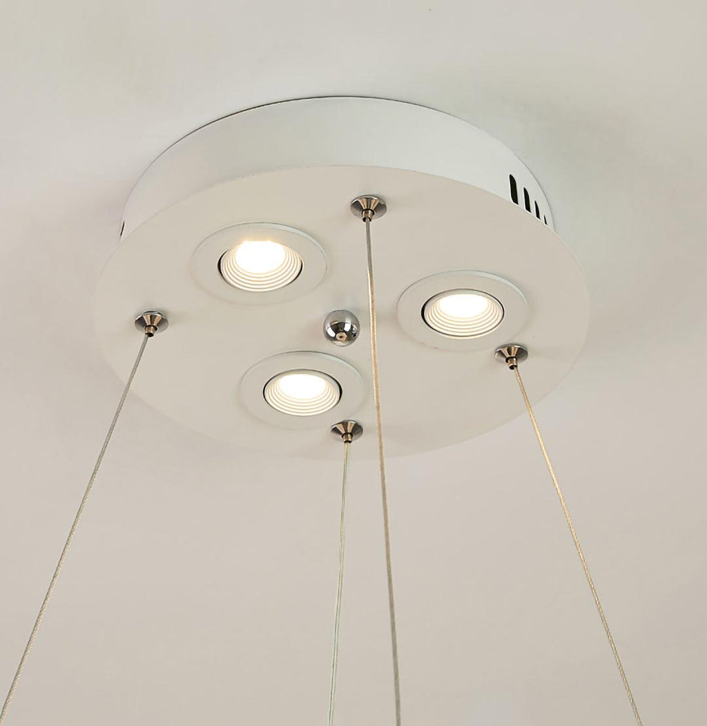 Looking up at the canopy of this Clérachic pendant, with three recessed spotlights and the cables running down.