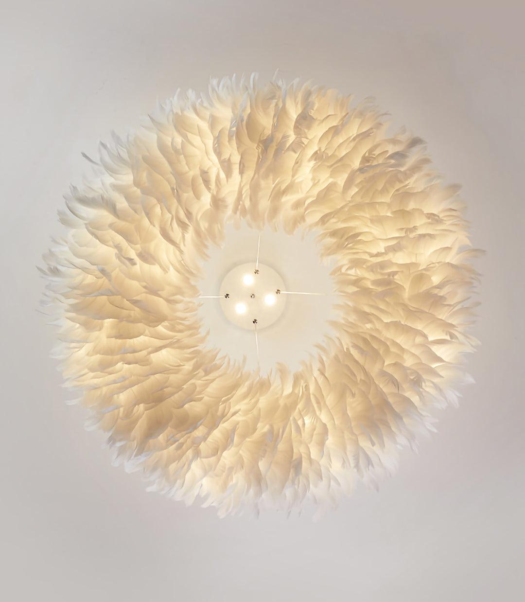 Looking straight up at the lit feather ring of this Clérachic pendant, with its canopy and spotlights at the centre.