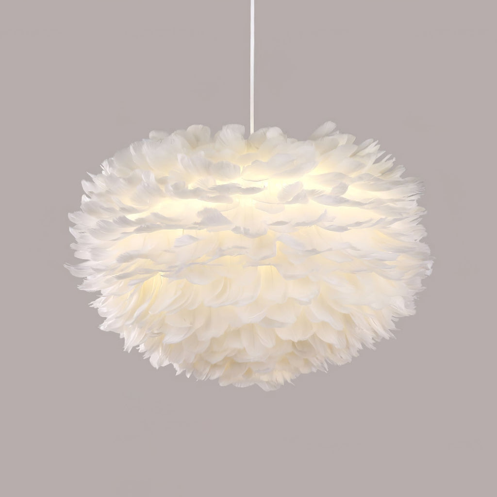 A full, rounded Clérachic feather pendant on a white cable against a muted mauve-grey backdrop.