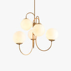 Product shot of the Clérachic gold gooseneck chandelier against a white backdrop, showing its opal glass globes and curved brass arms.