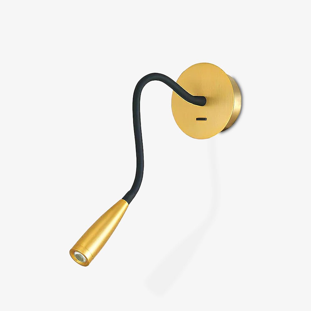 Gold Clérachic wall light on a plain white backdrop, with a round brass backplate and a black flexible arm ending in a small spotlight head.