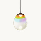 A single Clérachic glass pendant on a plain white backdrop, its clear teardrop shade banded with rainbow colour near a dark top cap.