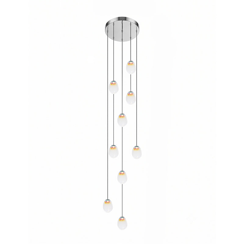 Render of a Clérachic cluster of glass pendants stepping down in a loose column from a round chrome ceiling plate on white.