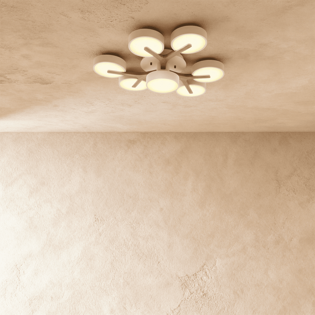 Clérachic's ceiling light in white, a seven-head cluster with light wood branches radiating from the centre.
