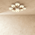 Clérachic's ceiling light in white, nine round diffusers branching from a central wood-topped base overhead.
