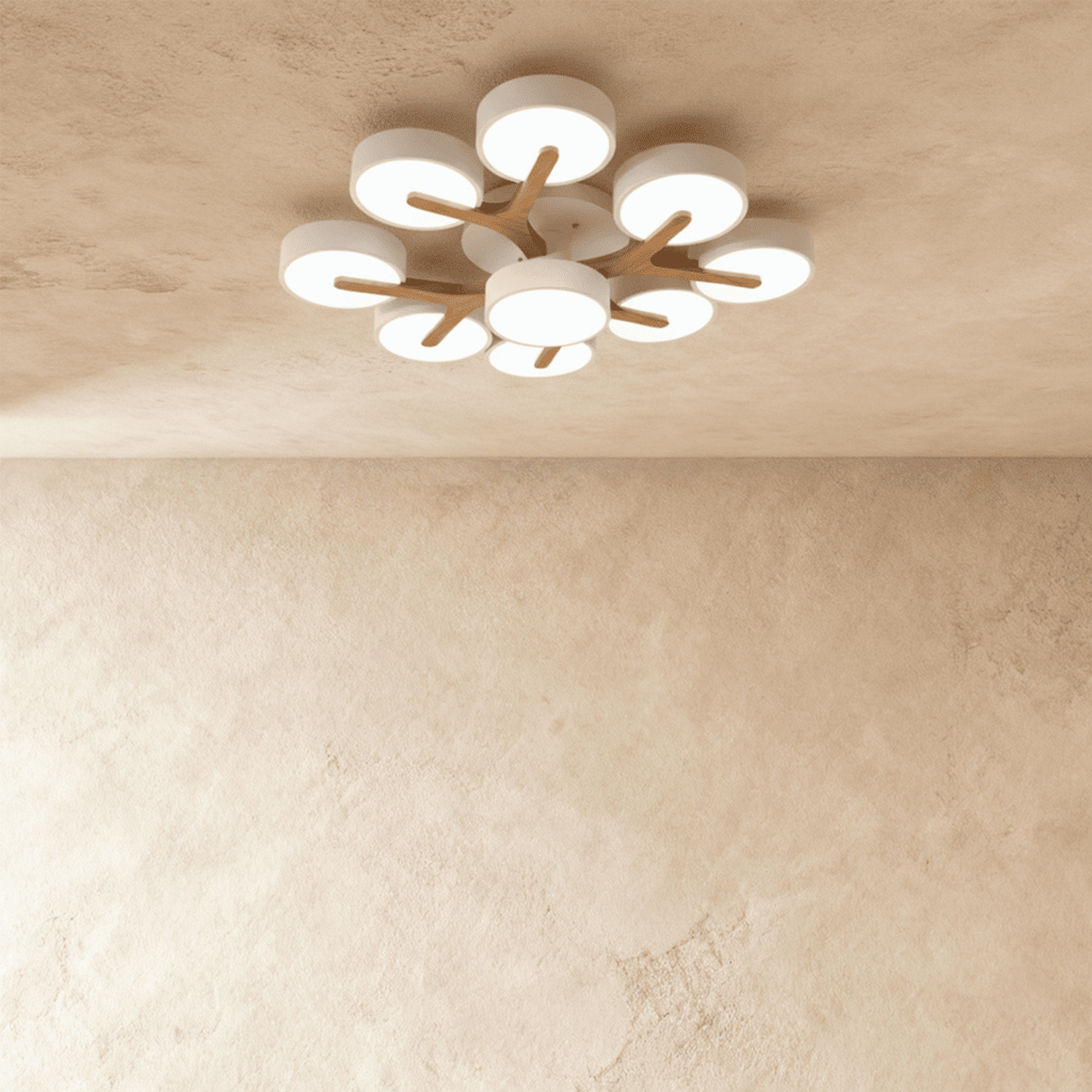 Overhead view of the Clérachic ceiling light in white, its nine-head cluster glowing softly against the ceiling.