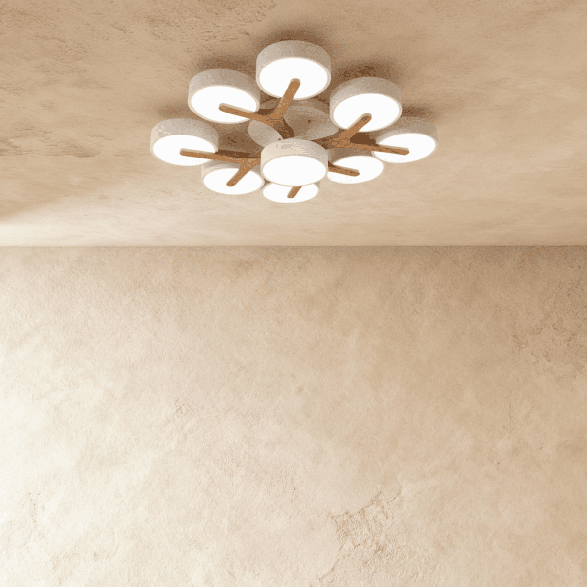 Overhead view of the Clérachic ceiling light in white, its nine-head cluster glowing softly against the ceiling.