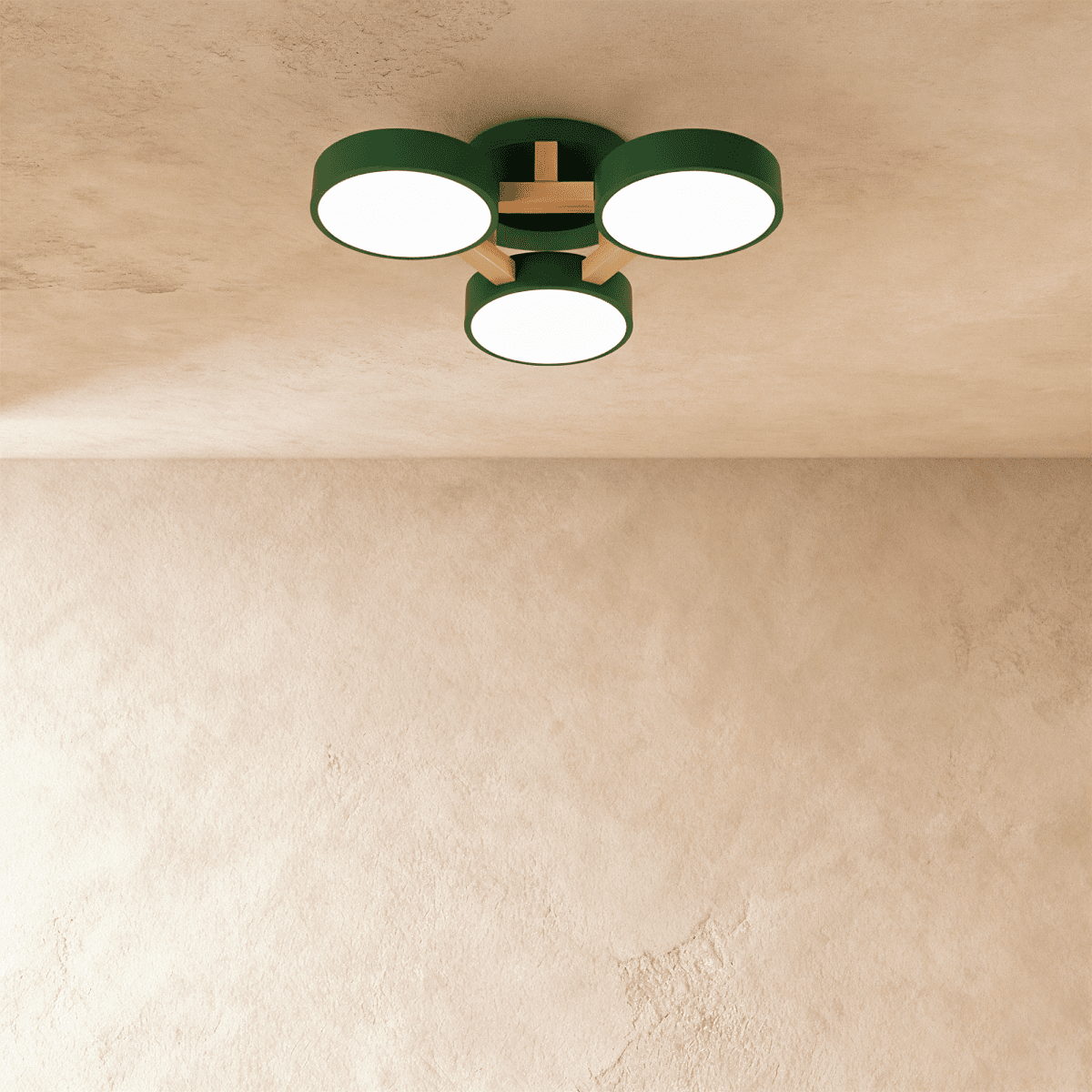 Clérachic's ceiling light in green, three drum shades on a light wood cross bar, photographed from below.