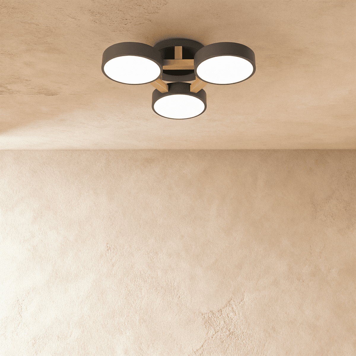 Clérachic's ceiling light in charcoal gray, three drum shades set on a light wood cross bar overhead.